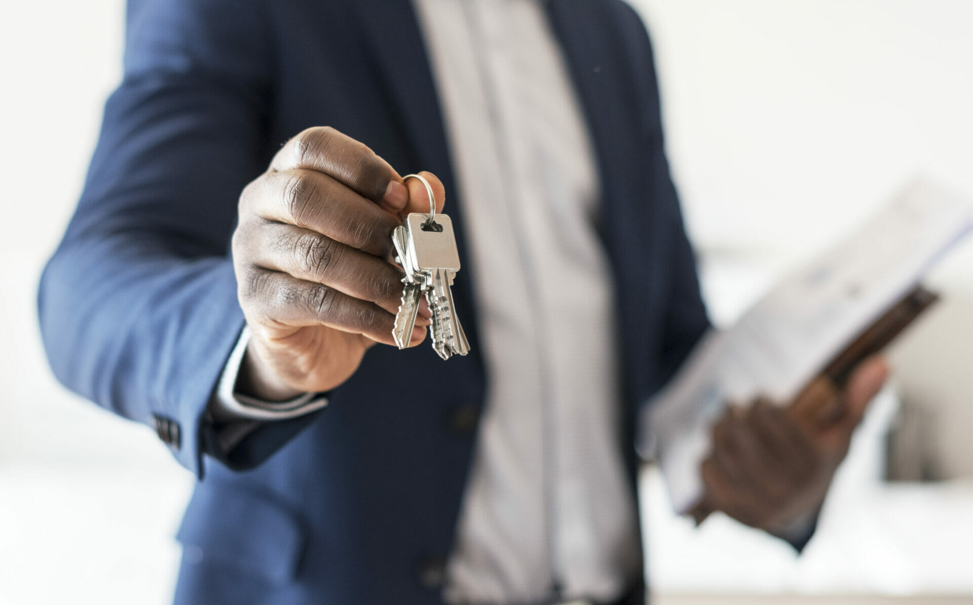 real estate agent handing the house key 2021 08 27 00 02 17 utc
