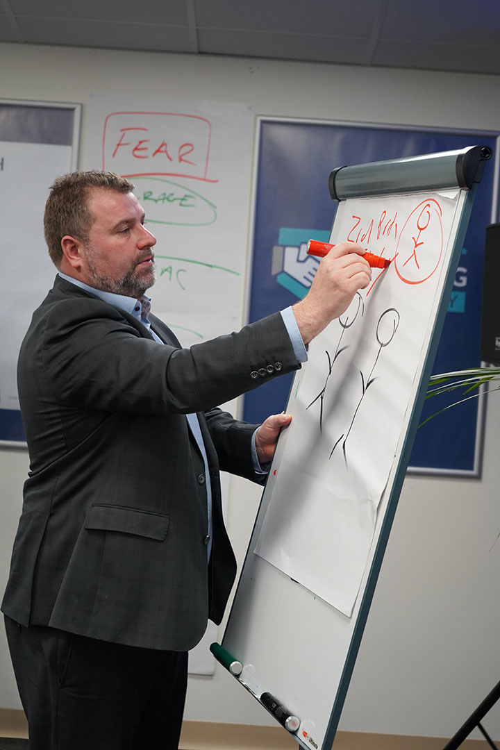Matt Elwell teaching at the whiteboard